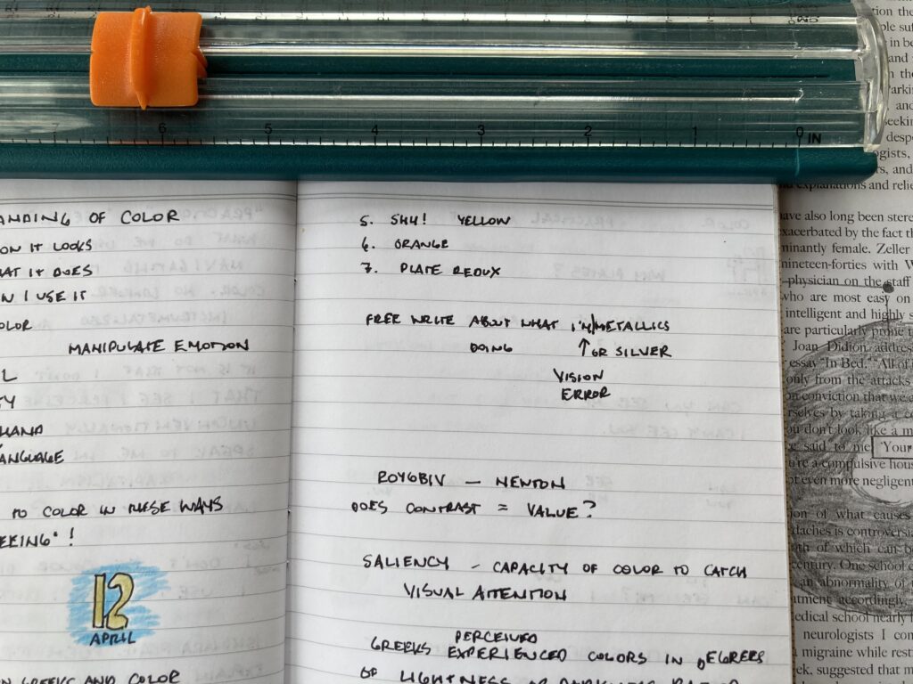 messy black text in a journal, two words mashed together: I'm/metallics, then an arrow pointing to them and more words: Vision error